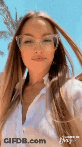 Woman In Glasses And White Shirt Posing GIF