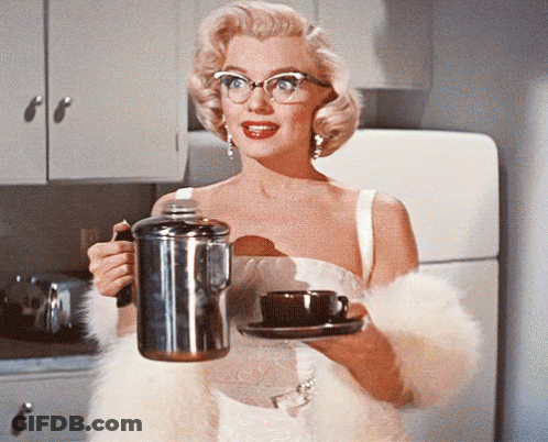 Woman In Glasses Holding Coffee Pot And Cup Of Coffee GIF