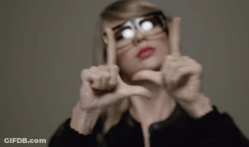 Woman In Glasses Making Heart Shape GIF