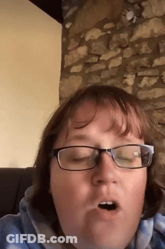Woman In Glasses Making Open-Mouthed Face GIF