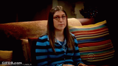 Woman In Glasses On Couch With Colorful Pillows Fashioncircus Tumblr GIF