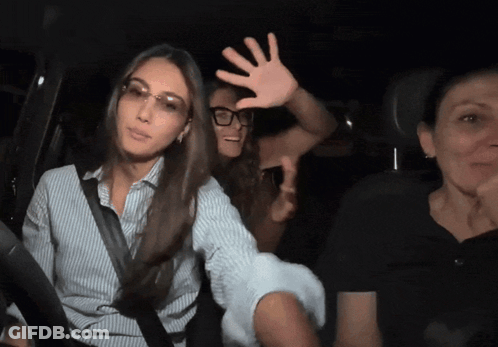 Woman In Glasses Raising Hand GIF