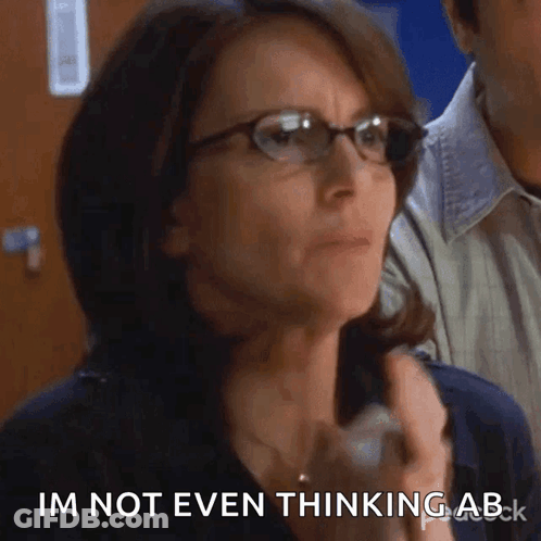 Woman In Glasses Saying I'm Not Even Thinking Ab GIF