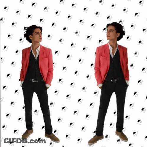 Woman In Glasses Says Alright To Man In Suit GIF