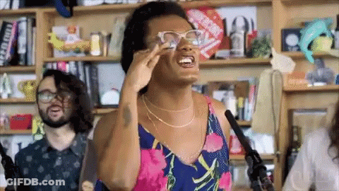 Woman In Glasses Singing Into Microphone GIF