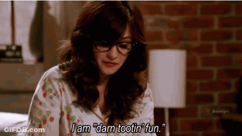 Woman In Glasses Sitting On Bed Saying I Am Darn Tootin Fun GIF