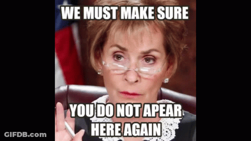 Woman In Glasses Sitting With Meme Saying We Must Make Sure You Do Not Appear Here Again GIF
