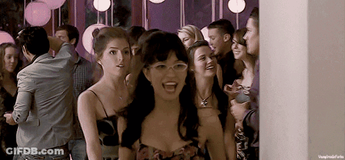 Woman In Glasses Standing In Crowd GIF