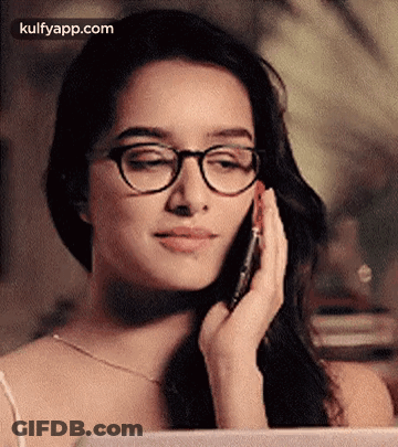 Woman In Glasses Talking On Phone GIF