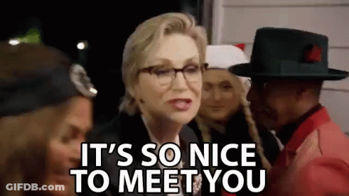 Woman In Glasses Talking To Man In Hat Saying It's So Nice To Meet You GIF