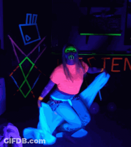 Woman In Glow In The Dark Outfit In Front Of Listen Sign GIF