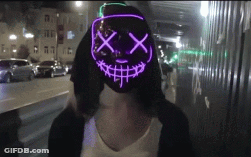 Woman In Glow In The Dark Smiley Mask GIF