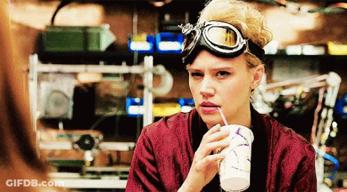 Woman In Goggles Drinking Through Straw GIF