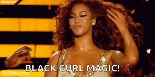 Woman In Gold Dress Holding Hair Saying Black Curl Magic GIF