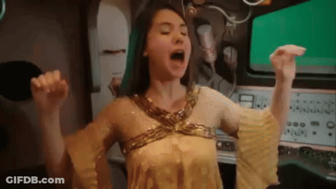 Woman In Gold Dress Screaming Arms Up GIF
