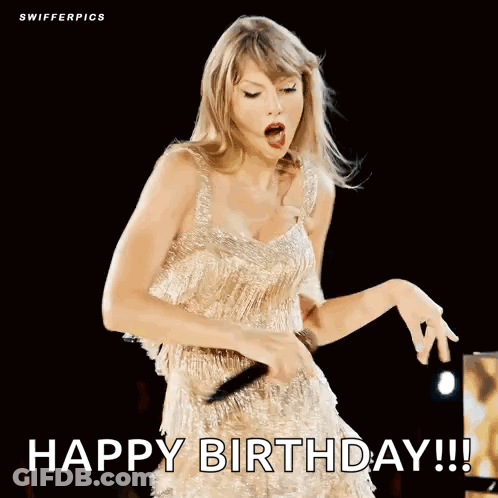 Woman In Gold Dress Singing Into Microphone GIF