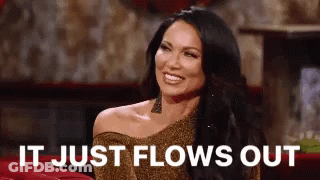 Woman In Gold Dress Smiling Says It Just Flows Out GIF