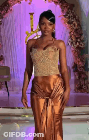 Woman In Gold Dress Walking Runway At Fashion Show GIF