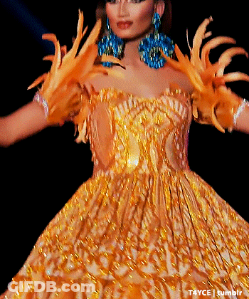 Woman In Gold Dress With Feathered Gloves And Earrings Photographed By Tayce Tumblr GIF