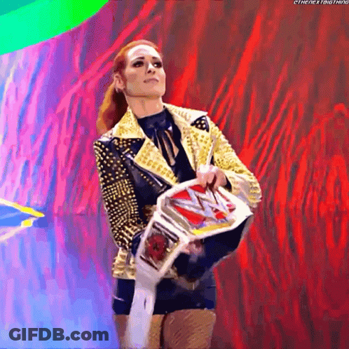 Woman In Gold Jacket Holding Wrestling Belt GIF