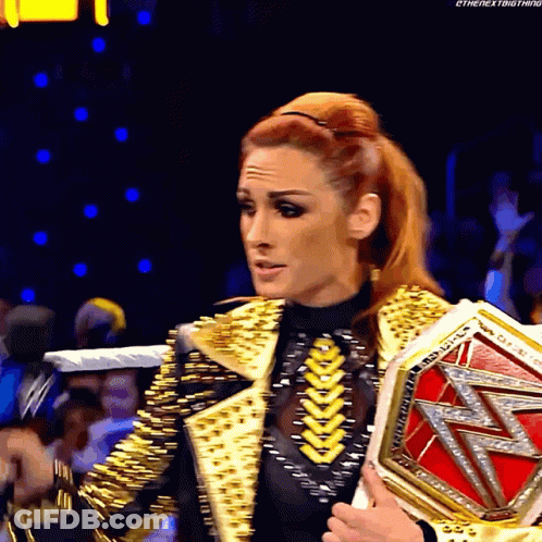 Woman In Gold Jacket Holding Wrestling Championship GIF