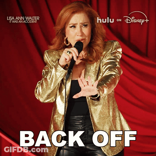 Woman In Gold Jacket Singing Into Microphone Back Off GIF