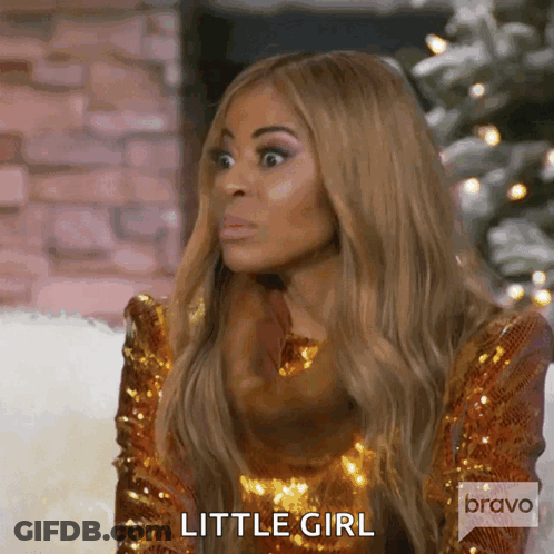 Woman In Gold Sequined Dress Making Funny Face Saying Little Girl GIF