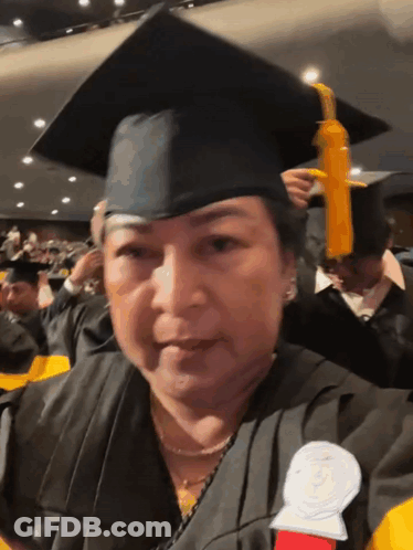 Woman In Graduation Cap And Gown GIF