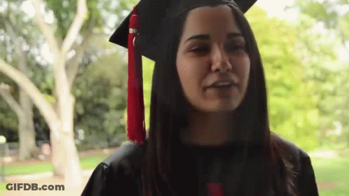 Woman In Graduation Cap And Gown GIF