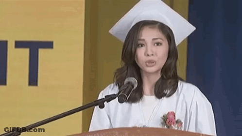 Woman In Graduation Cap And Gown At Podium GIF