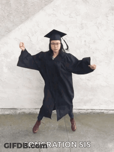 Woman In Graduation Cap And Gown Dancing GIF