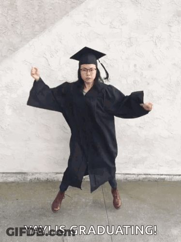 Woman In Graduation Cap And Gown Dancing GIF