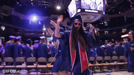 Woman In Graduation Cap And Gown Dancing GIF