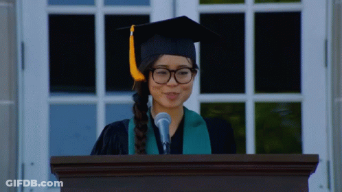 Woman In Graduation Cap And Gown Giving Speech GIF