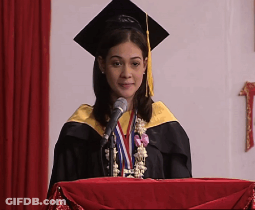Woman In Graduation Cap And Gown Giving Speech GIF