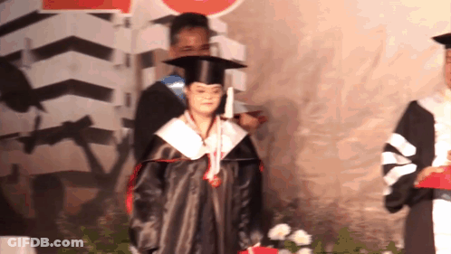 Woman In Graduation Cap And Gown GIF
