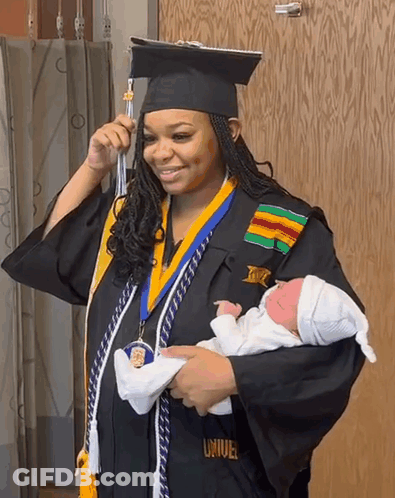 Woman In Graduation Cap And Gown Holding Baby GIF