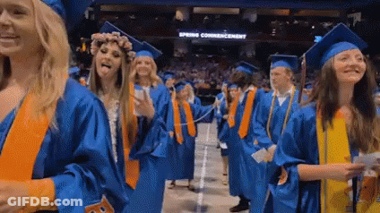 Woman In Graduation Cap And Gown Smiling GIF