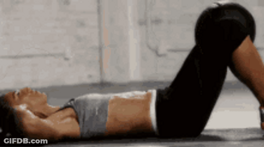 Woman In Gray Doing Abs Crunches Exercise GIF