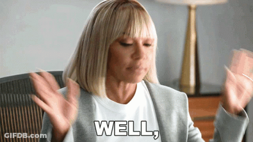 Woman In Gray Jacket Saying Well GIF