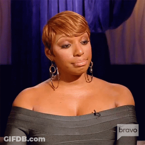 Woman In Gray Off-Shoulder Dress With Hoop Earrings On Bravo TV GIF