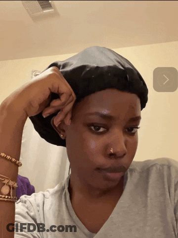 Woman In Gray Shirt And Black Hat GIF