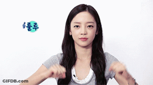 Woman In Gray Shirt Making Funny Face GIF