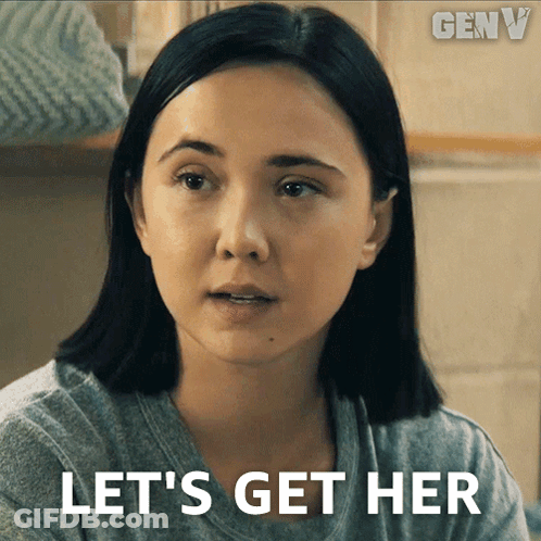 Woman In Gray Shirt Saying Let's Get Her GIF