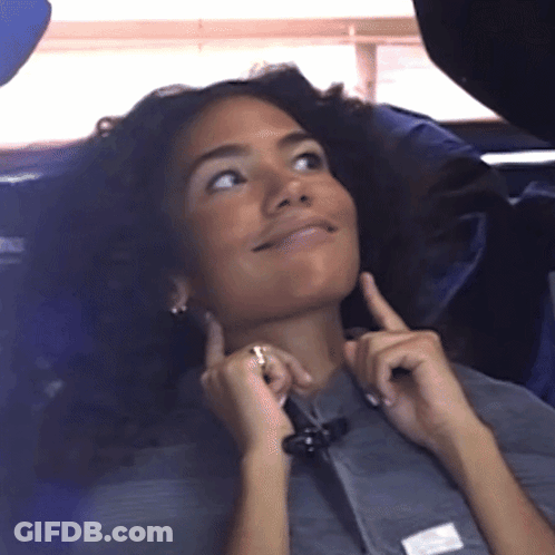Woman In Gray Shirt With White Patch On Sleeve GIF