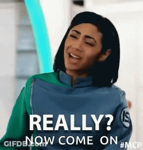 Woman In Green And Blue Jacket Making Funny Face GIF