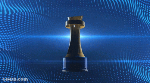 Woman In Green And Brown Striped Shirt Holding Winner Trophy GIF