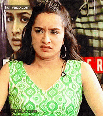 Woman In Green And White Dress Making Face GIF