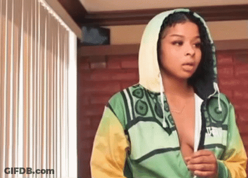 Woman In Green And Yellow Jacket With Hood GIF