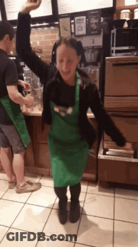 Woman In Green Apron Dancing GIF
